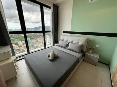 a teddy bear sitting on a bed in a bedroom at PICO VR, 3BR 3 queen bed, 2 car park, UrbanSuites by XW Home in Jelutong