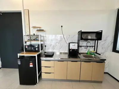 a kitchen with a sink and a counter top at PICO VR, 3BR 3 queen bed, 2 car park, UrbanSuites by XW Home in Jelutong