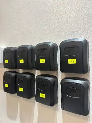 a group of four black plasticatoons with yellow tags at Be Right Back Loft - Alma in Kampong Ayer Merah