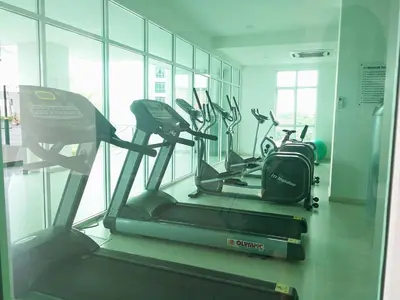 a gym with several cardio machines in a room at 23th 2BR1B Straits Garden Suites Georgetown Jelutong in Jelutong