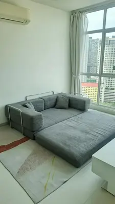 a couch in a living room with a large window at 23th 2BR1B Straits Garden Suites Georgetown Jelutong in Jelutong
