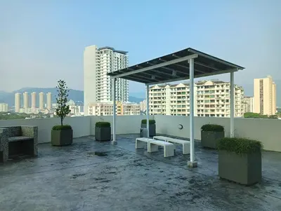 a pavilion with a bench on a rooftop with buildings at 23th 2BR1B Straits Garden Suites Georgetown Jelutong in Jelutong