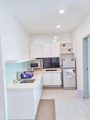 a kitchen with white cabinets and a refrigerator at 23th 2BR1B Straits Garden Suites Georgetown Jelutong in Jelutong