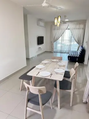 a dining table and chairs in a living room at TuR15 SPlCE 10pax 4room Private House in Bayan Lepas