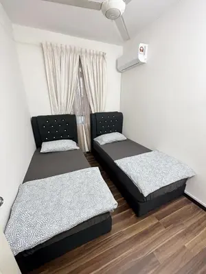 two beds in a room with a window at TuR15 SPlCE 10pax 4room Private House in Bayan Lepas