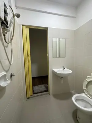 a bathroom with a toilet and a sink at TuR15 SPlCE 10pax 4room Private House in Bayan Lepas
