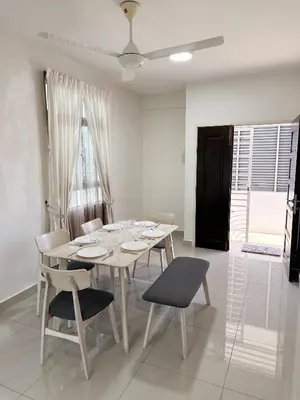 a white dining room with a table and chairs at TuR15 SPlCE 10pax 4room Private House in Bayan Lepas