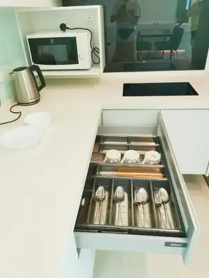 a kitchen drawer with spoons and a microwave at 29th 2BR1B Straits Garden Suites Georgetown Penang in George Town