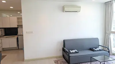 a living room with a couch and a table at 29th 2BR1B Straits Garden Suites Georgetown Penang in George Town