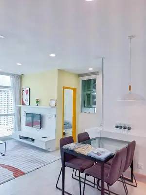 a living room with a table and chairs and a tv at 29th 2BR1B Straits Garden Suites Georgetown Penang in George Town