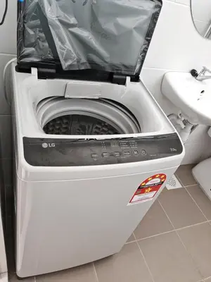 a washing machine with its door open in a bathroom at Modern Comfort Seri Iskandar in Seri Iskandar