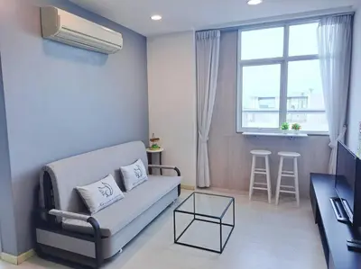 a living room with a couch and a window at 28th 2BR1B Straits Garden Suites Georgetown Penang in Jelutong