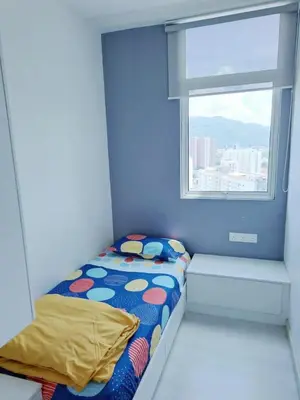 a small bed in a room with a window at 28th 2BR1B Straits Garden Suites Georgetown Penang in Jelutong