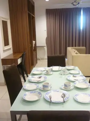 a table with blue and white plates on it at Studio at Middle floor sea view in George Town