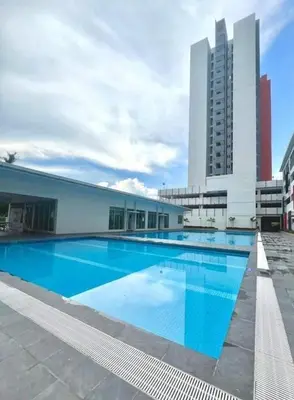 a large swimming pool in front of a building at Ipoh Anderson Free WiFi & Tvbox 4ppl in Ipoh