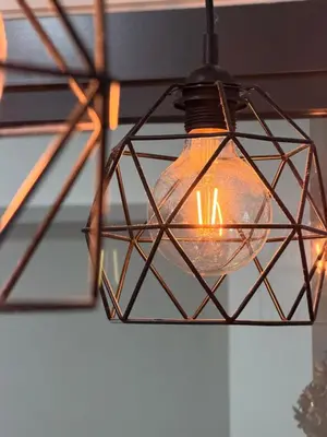a light fixture hanging from a ceiling at NeoSkyhigh Suites in Batu Kawan