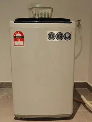 a white refrigerator with a basket on top of it at Luxe Romance with Seaview & Bathtub - Jazz Suites by Ocean Luxe in Tanjong Tokong