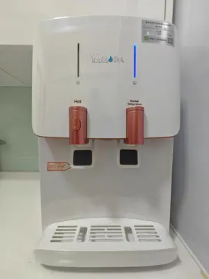 a coffee maker sitting on top of a refrigerator at Luxe Romance with Seaview & Bathtub - Jazz Suites by Ocean Luxe in Tanjong Tokong