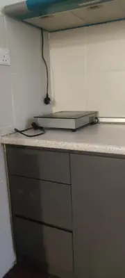 a laptop sitting on a counter in a kitchen at Raissa Resident palas horizon Cameron Highlands in Brinchang