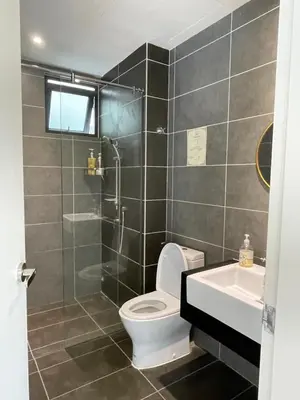 a bathroom with a toilet and a shower and a sink at Sunway Onsen Ipoh Tambun Cozy Retreat 8pax in Tambun
