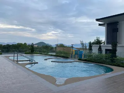 a swimming pool in the middle of a building at Sunway Onsen Ipoh Tambun Cozy Retreat 8pax in Tambun