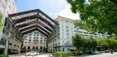 a large building with a metal structure on a city street at Jazz Luxury Suites BY MEXI in Tanjong Tokong