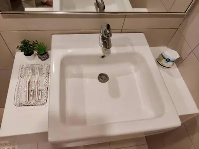 a white sink with a faucet in a bathroom at Sea Breeze Haven 2BR Seaview w Bathtub 海风乐园海景套房 by Minsù in Tanjong Tokong