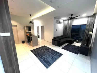 a living room with a black couch and a table at The Horizon Ipoh 3BR MAGNOLIA -by Goswell in Ipoh