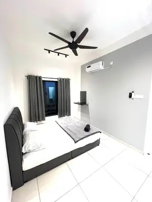 a bedroom with a bed and a ceiling fan at The Horizon Ipoh 3BR MAGNOLIA -by Goswell in Ipoh