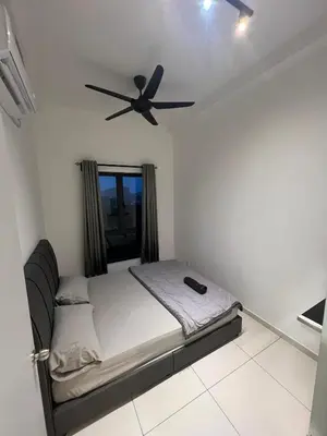 a bedroom with a bed with a ceiling fan at The Horizon Ipoh 3BR MAGNOLIA -by Goswell in Ipoh
