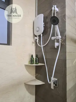a shower in a bathroom with a hair dryer on the wall at The Cove Hillside Residence Ipoh-Nature On Earth in Ipoh