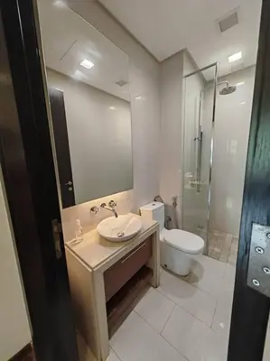 a bathroom with a sink and a toilet at Sweet Cozy Marina Suite at Straits Quay in Tanjong Tokong