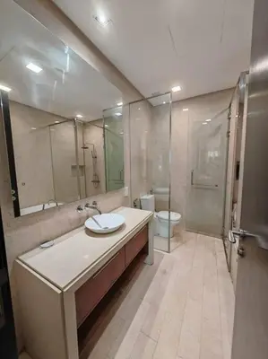 a bathroom with a sink and a shower and a toilet at Sweet Cozy Marina Suite at Straits Quay in Tanjong Tokong