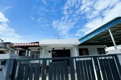 a house with a gate in front of it at Bercham 81 Homestay in Ipoh