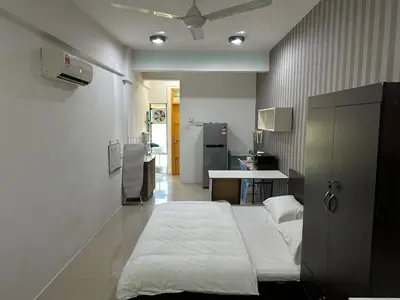 a hospital room with a bed and a kitchen at BYSS Homestay Studio in Kampar