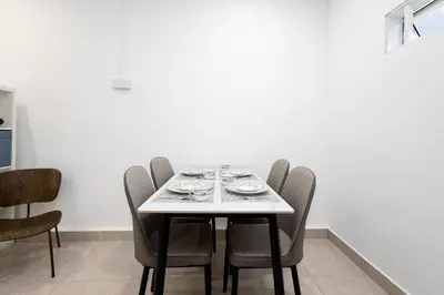 a dining room with a table and chairs at Casa for 4 - Private Studio Ipoh in Ipoh