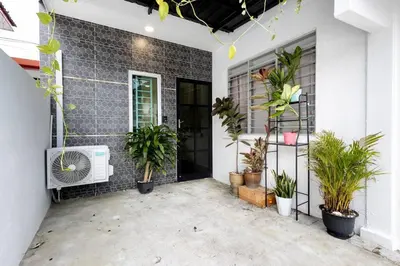 a patio with plants in front of a building at Casa for 4 - Private Studio Ipoh in Ipoh
