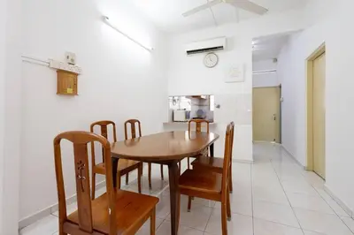 a kitchen and dining room with a wooden table and chairs at Homie4u - Ipoh Garden East 8 pax in Ipoh