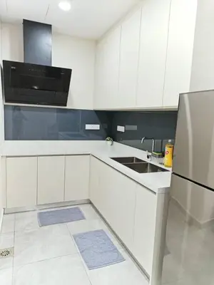a white kitchen with a sink and a refrigerator at Penang Georgetown Jelutong Luxury House 1-12Pax in Jelutong