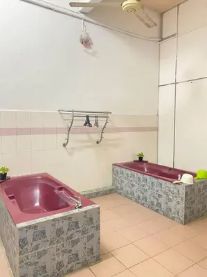 a bathroom with a red tub in a room at Near Aeon Taiping and Taiping Sentral Mall in Kamunting