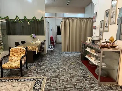 a room with a table and a dining room at Near Aeon Taiping and Taiping Sentral Mall in Kamunting