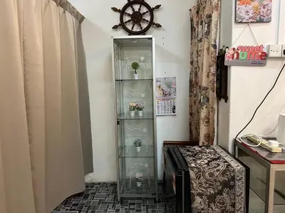 a glass shelf in a room with a clock on the wall at Near Aeon Taiping and Taiping Sentral Mall in Kamunting