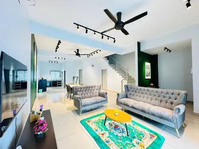 a living room with two couches and a table at Rania Pearl Double Storey Family Home, Bertam Penang Homestay in Kepala Batas