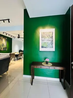 a green wall with a table in a room at Rania Pearl Double Storey Family Home, Bertam Penang Homestay in Kepala Batas