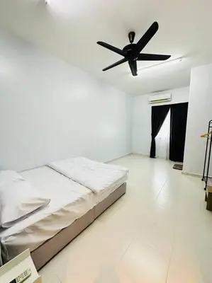 a bedroom with a bed and a ceiling fan at Rania Pearl Double Storey Family Home, Bertam Penang Homestay in Kepala Batas