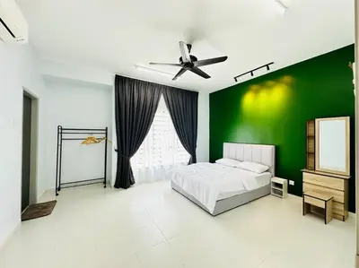 a green bedroom with a bed and a green wall at Rania Pearl Double Storey Family Home, Bertam Penang Homestay in Kepala Batas