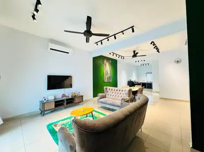 a living room with a couch and a tv at Rania Pearl Double Storey Family Home, Bertam Penang Homestay in Kepala Batas