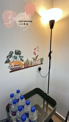 a table with a bunch of water bottles on it at Little Homestay - \u5c0f\u5c0f\u6c11\u5bbf in Ipoh
