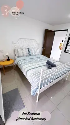 a bed in a white room with a bed frame at Little Homestay - \u5c0f\u5c0f\u6c11\u5bbf in Ipoh