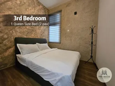 a bedroom with a large bed with a tripod at The Cove Hillside Residence Ipoh - Nostalgic Terracotta in Ipoh